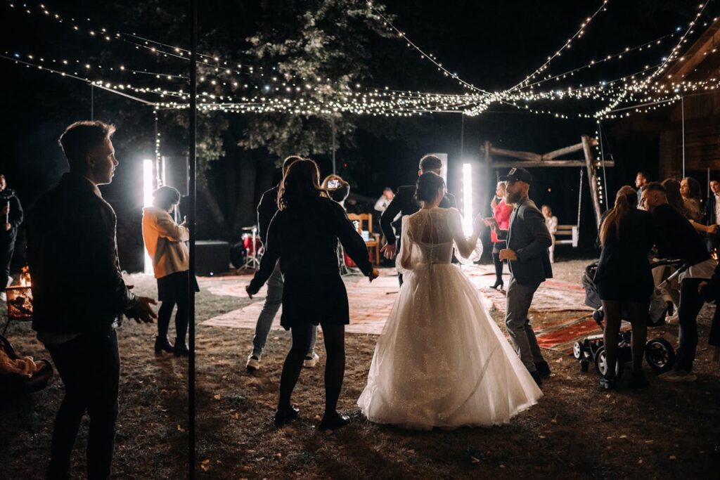 Wedding Guests and the Newlyweds Dancing at the Wedding Reception